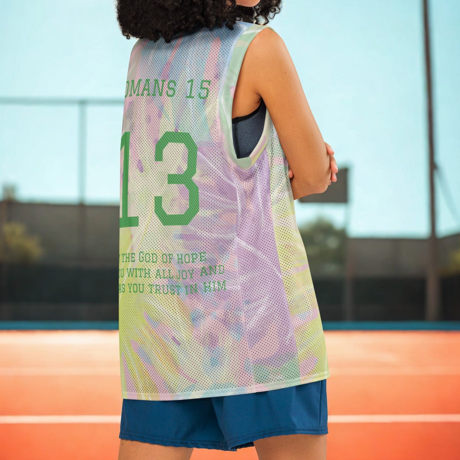 Person wearing a colorful basketball jersey with text on a court